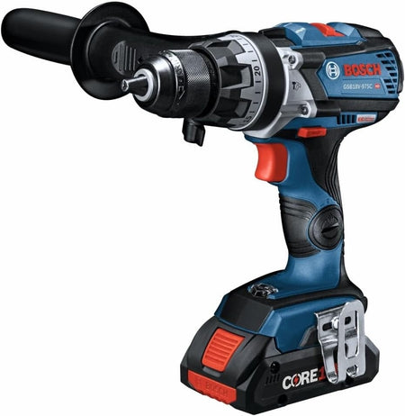 A studio product shot of the complete Bosch hammer drill driver kit, including the handheld tool with an attached side-assist handle, two CORE18V 4.0 Ah batteries, a battery charger, and a blue and black zippered carrying bag.