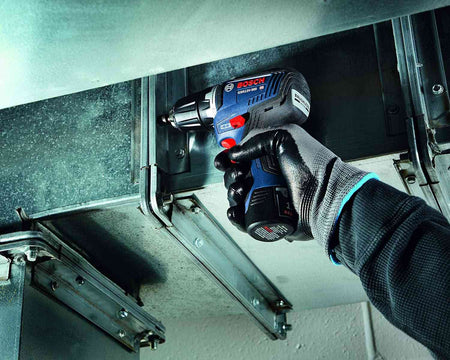 Top-down view of the brushless drill/driver showcasing the red mechanical two-speed gear selector switch and the ergonomic textured grip on the motor housing.