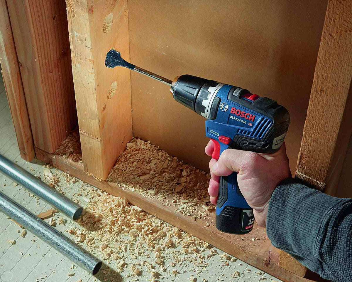 A close-up view of the drill/driver head showing the keyless chuck and the LED worklight activated to demonstrate its ability to clarify dark workspaces.