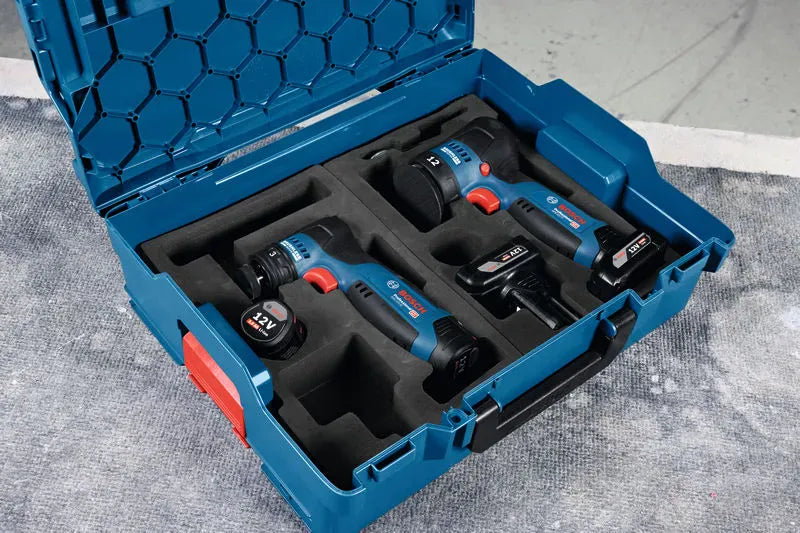 An open blue Bosch L-Boxx system hard storage case fitted with a custom-cut dark foam insert organizer tray. Securely nested inside the matching foam slots are the Bosch 12V max cordless detail orbital sander bare tool with a 3mm orbit balance ring, a compact matching 12V palm buffer equipped with a green foam spot repair pad, and a spare rechargeable lithium-ion battery cylinder cell.