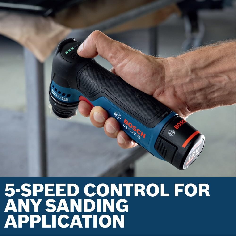 A close-up view of a technician's hand gripping the handle of the Bosch GSS12V-32N cordless detail sander, with their thumb testing the top-mounted digital interface buttons. The green LED battery status indicator bars are fully illuminated, set above a bold blue graphic text banner reading 5-speed control for any sanding application.