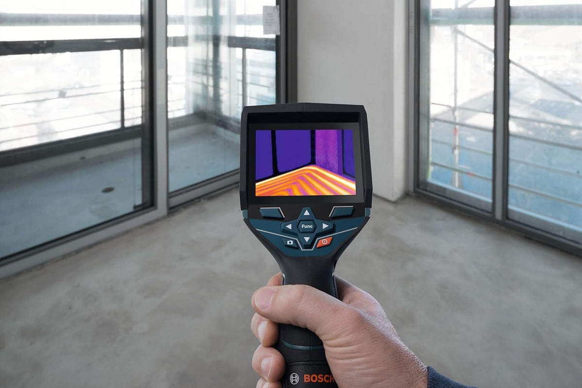 First-person view of the thermal camera revealing the serpentine pattern of radiant floor heating pipes hidden beneath the floor surface