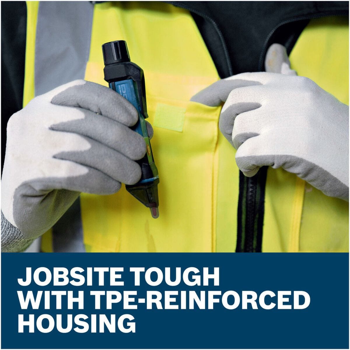 A field contractor wearing protective work gloves pulling the slim Bosch GVD1000-15 non-contact voltage detector pen out from the front pocket of a high-visibility yellow safety vest. The image features a lower text graphic stating Jobsite tough with TPE-reinforced housing, highlighting the tool's impact-resistant construction.
