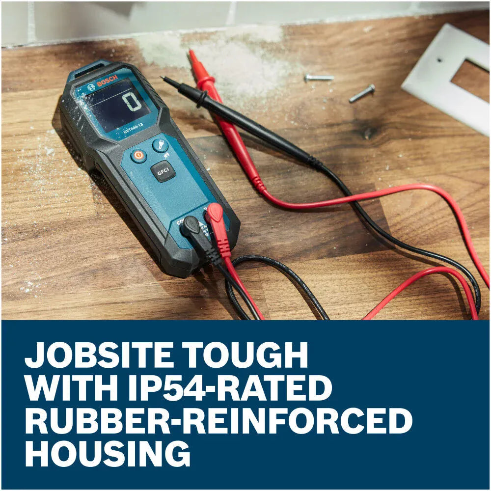 The Bosch GVT600-13 Digital Volt Meter resting on a wooden countertop next to an open outlet receptacle installation. The tool is connected to its premium red and black replaceable test leads with the screen displaying a baseline reading, set above a text banner reading Jobsite tough with IP54-rated rubber-reinforced housing.
