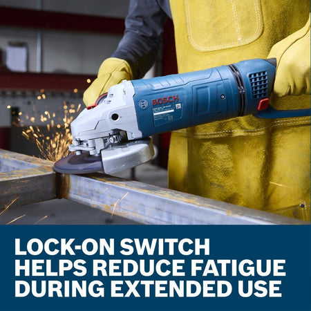 An action close-up showing a workshop fabricator wearing bright yellow leather safety welding gloves and a matching heavy leather apron operating the Bosch 15-Amp metal angle grinder. The tradesman applies steady mechanical pressure to grind down a thick steel frame bar workpiece on a table setup, set above a lower marketing text banner reading Lock-on switch helps reduce fatigue during extended use.