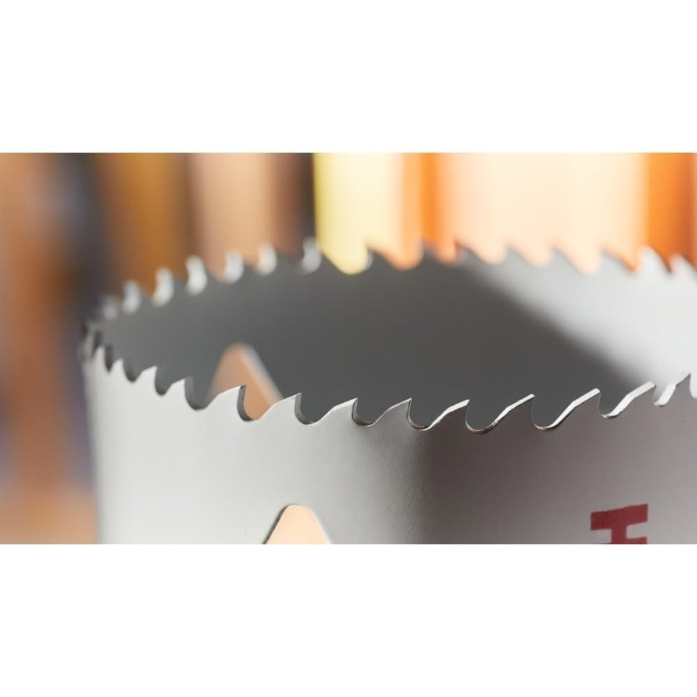 Macro view of the hole saw's cutting edge highlighting the sharp, alternating progressor tooth geometry.