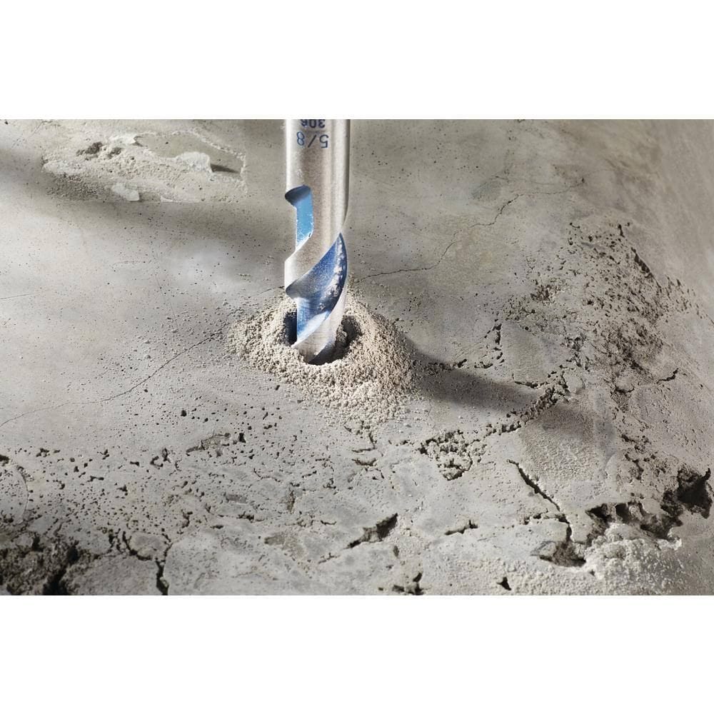 An action shot showing the Bosch hammer drill bit as it bores into a concrete surface, demonstrating effective dust removal from the hole during use.