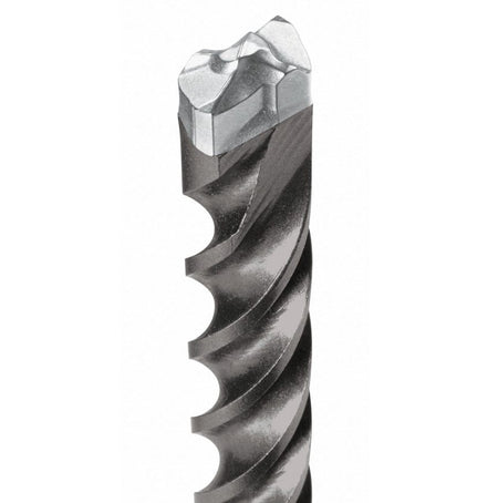 An extreme close-up of the 100% full-carbide head of a Bosch Bulldog Xtreme drill bit, showing the centric conical tip and the diffusion-bonded carbide-to-steel connection.