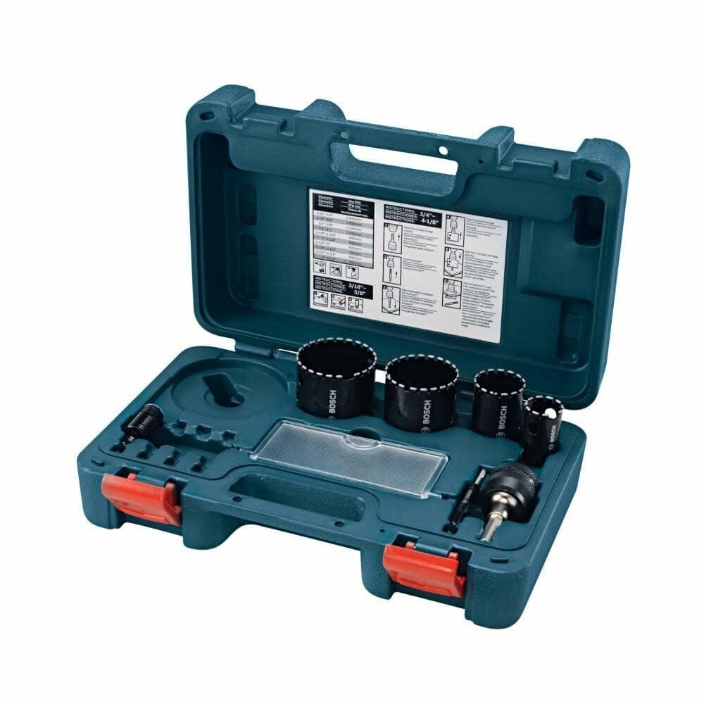 The open blue carrying case of the Bosch 7-piece diamond hole saw set, showing the six hole saws and the quick-change mandrel arranged in their designated slots.