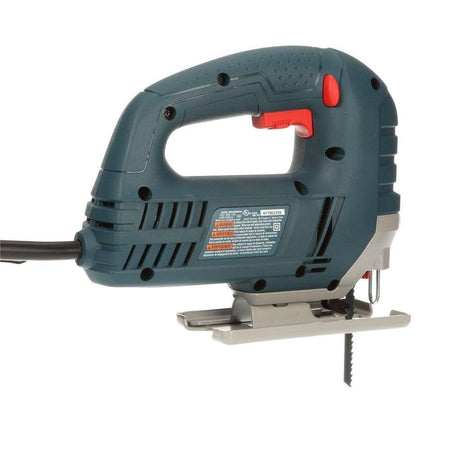 Handheld electric jigsaw with red trigger and downward blade; safety label visible on blue and black casing.
