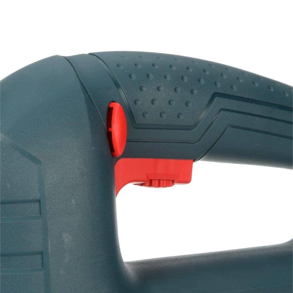 Close-up of power tool handle with textured grip, red trigger button, and safety lock switch for ergonomic control.