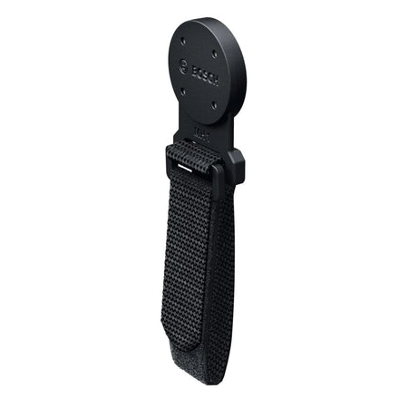 A close-up studio product shot of the standalone Bosch MH1 Professional Magnetic Hanger accessory isolated against a white background. The image clearly showcases the circular, non-conductive rubber-coated magnetic mounting disc featuring the engraved Bosch brand name, transitioning into a durable plastic base holding an adjustable black hook-and-loop fabric webbing strap.