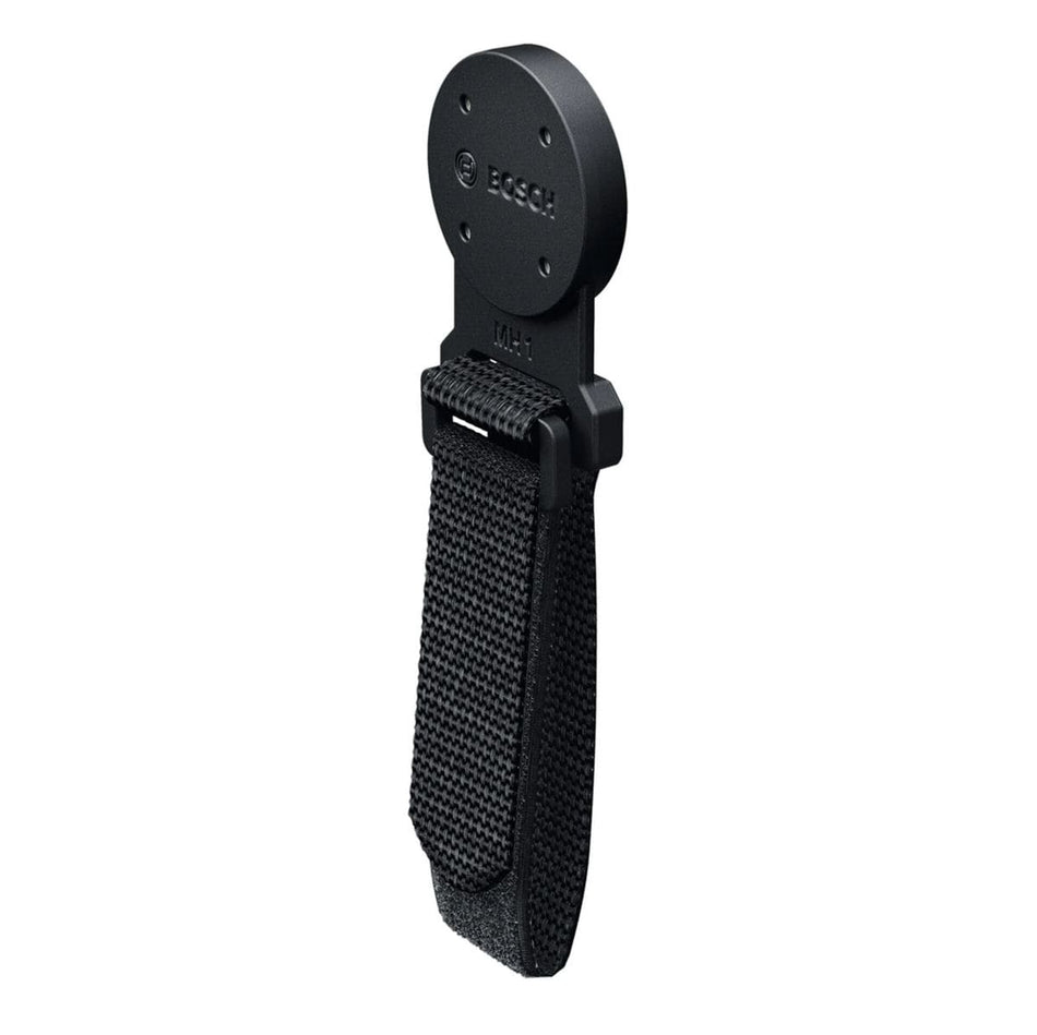A close-up studio product shot of the standalone Bosch MH1 Professional Magnetic Hanger accessory isolated against a white background. The image clearly showcases the circular, non-conductive rubber-coated magnetic mounting disc featuring the engraved Bosch brand name, transitioning into a durable plastic base holding an adjustable black hook-and-loop fabric webbing strap.