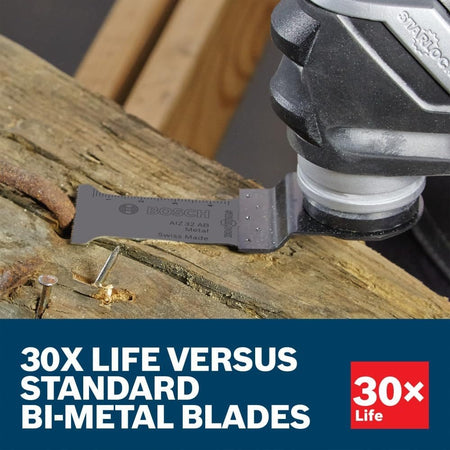 A close-up action photo of a Bosch Starlock carbide blade cutting through a thick rusted metal nail embedded in a wooden beam, demonstrating its 30X longer life than standard bi-metal oscillating blades.