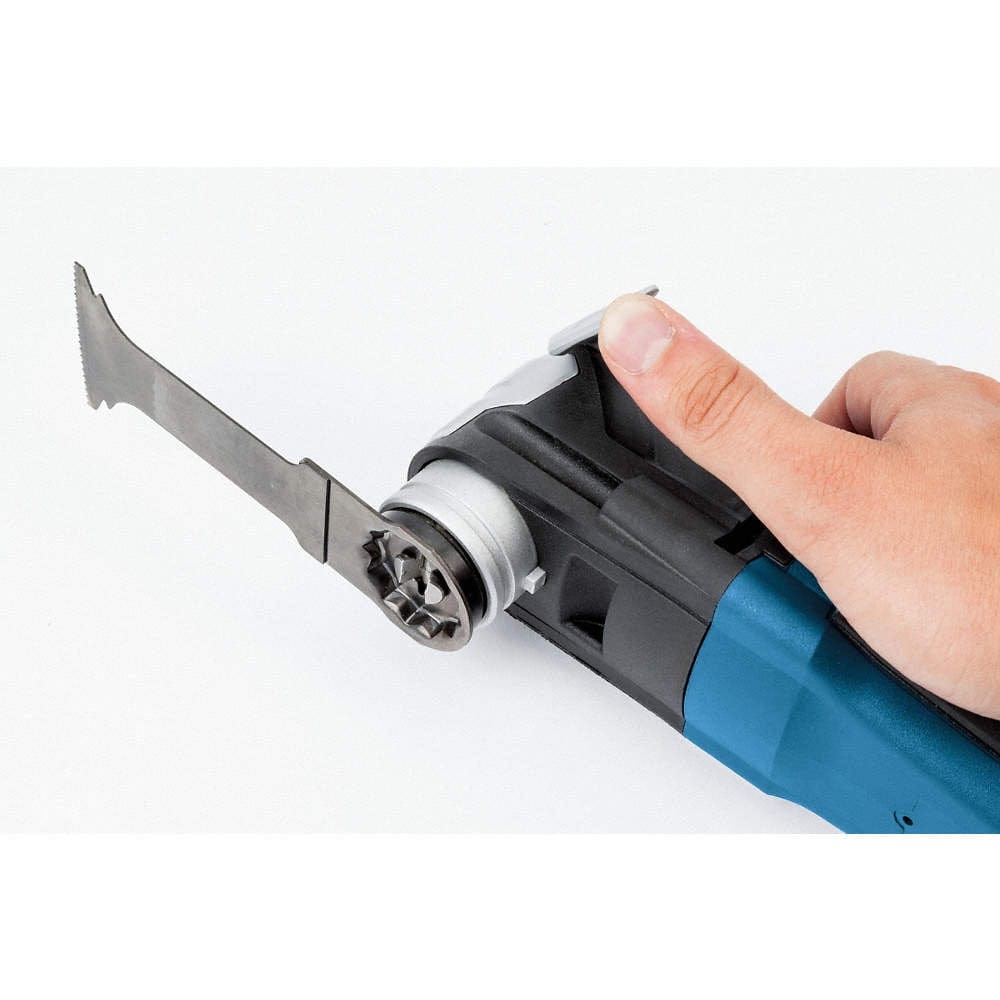 A hand holding a blue Bosch oscillating multi-tool equipped with the StarlockMax carbide blade.