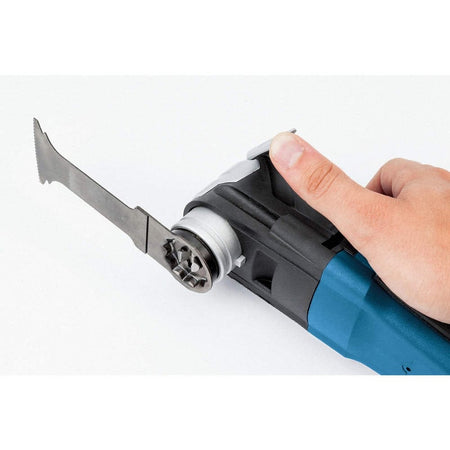 A hand holding a blue Bosch oscillating multi-tool equipped with the StarlockMax carbide blade.