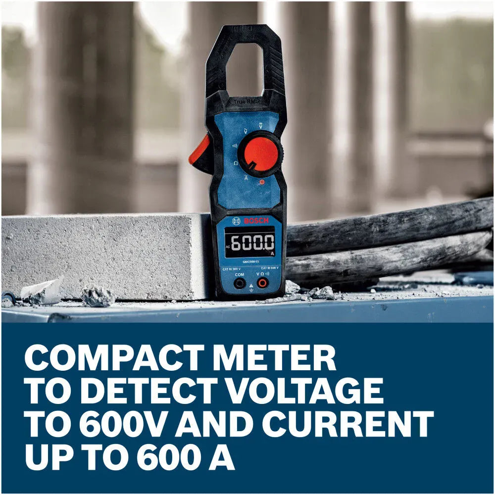 The heavy duty Bosch PRO GMC 600-15 Clamp Meter standing vertically on an industrial concrete and steel worksite next to a heavy power cable. The display shows a 600.0V reading, set above a text graphic that reads Compact meter to detect voltage to 600V and current up to 600 A.