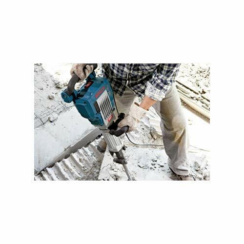 A worker operating the Bosch Jack breaker hammer to demolish a concrete floor, showing the tool in a real-world application.