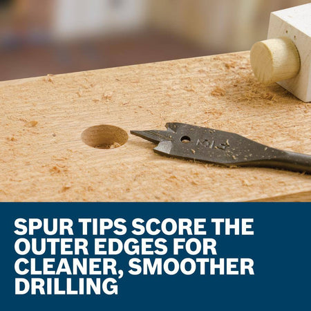 A close-up promotional graphic displaying a black paddle bit next to a freshly drilled hole in a timber block, paired with a lower blue banner text card reading Spur Tips Score the Outer Edges for Cleaner, Smoother Drilling.