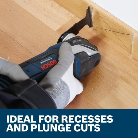 Action shot of the blade attached to a multi-tool making a plunge cut into baseboard with text highlighting ideal use for recesses and plunge cuts.