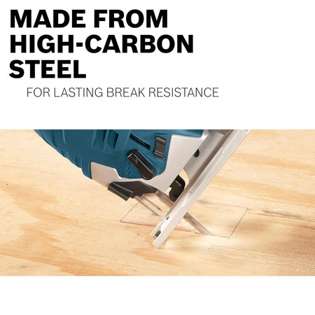 A close-up action shot of a Bosch jigsaw equipped with a high-carbon steel blade cutting a rectangular opening into a wooden surface, highlighting the blade's lasting break resistance.