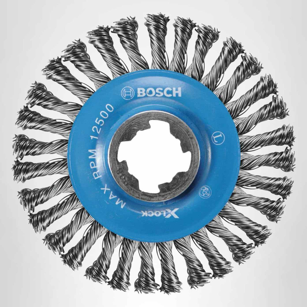 Studio view of the 4-1/2 inch wire wheel featuring a blue center hub with the X-Lock interface and knotted carbon steel bristles.