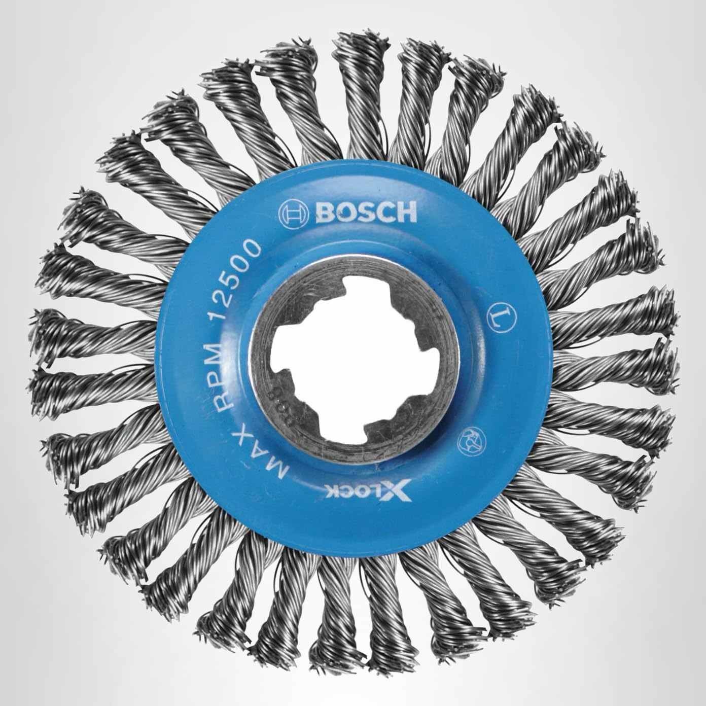 Studio view of the 4-1/2 inch wire wheel featuring a blue center hub with the X-Lock interface and knotted carbon steel bristles.