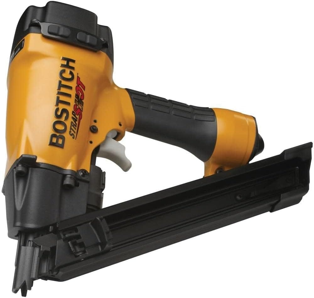 Action shot demonstrating the Bostitch MCN150 STRAPSHOT fastening a metal joist hanger connector to structural lumber, utilizing the exposed nosepiece for accurate nail placement.