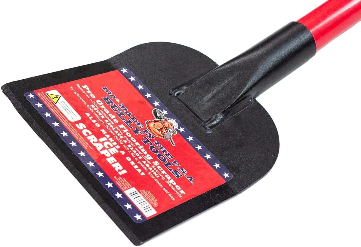 Close-up of the black steel scraper head displaying the red, white, and blue product label stating Pro Grade Flooring Scraper and 100% Made in the U.S.A.