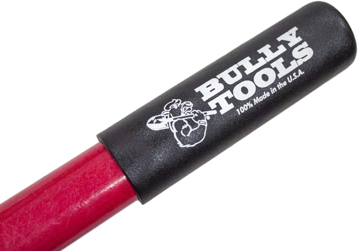 Close-up of the black rubber handle grip featuring the white Bully Tools logo with a bulldog graphic and text stating 100% Made in the U.S.A. on a red fiberglass handle.