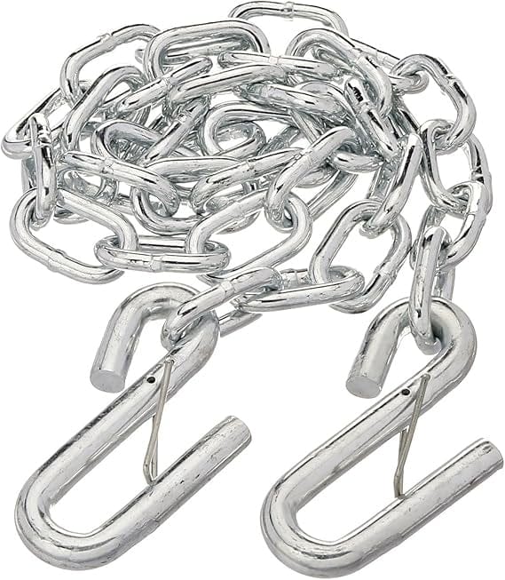Zinc-plated trailer safety chain coiled with two attached 7/16" latch-style S-hooks. The chain is made of silver-colored steel with oval links and spring-loaded hooks designed for secure towing connections. Measures 1/4" x 48" and rated to 5,000 lbs. Commonly used to keep trailers connected to tow vehicles in case of hitch failure.