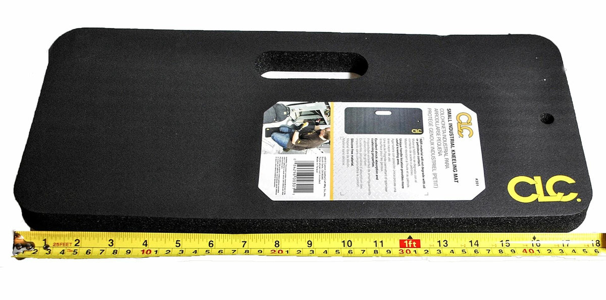 The CLC small kneeling pad next to a measuring tape, demonstrating its 18-inch length, with product packaging attached.