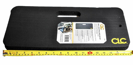 The CLC small kneeling pad next to a measuring tape, demonstrating its 18-inch length, with product packaging attached.