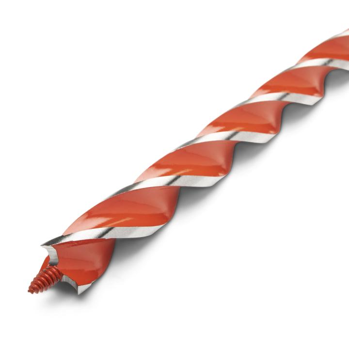 Crescent 7/8" x 13" Solid Auger Drill Bit close up of auger head. This is a close-up, angled shot of a long, thin drill bit against a white background. The bit has a bright orange, spiral cutting edge that runs almost its entire length, and the end of the bit shows the sharpened tip.