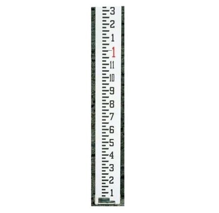 A detailed close-up of the CST/berger 06-816 measuring rod graduations in inches and tenths, highlighting the high-contrast weather-resistant markings on the surveying grade anodized alloy surface.