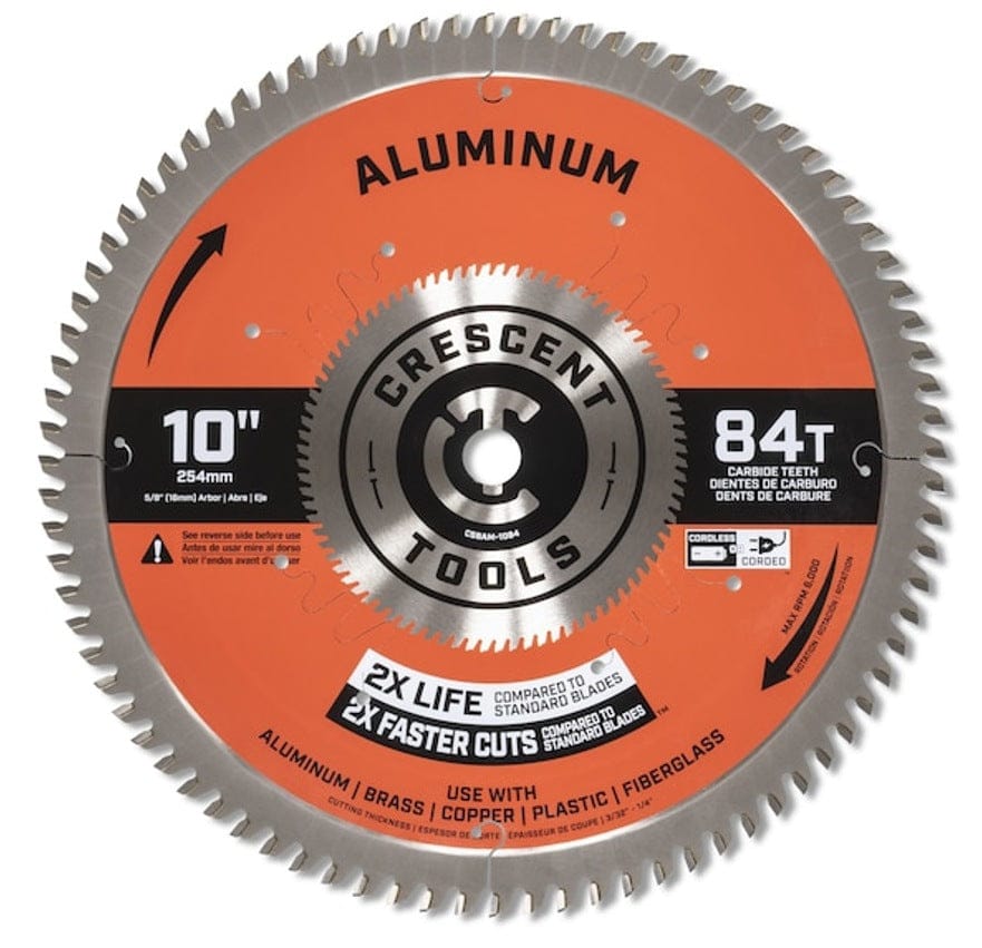 Front-side view of the Crescent 10-inch 84-tooth circular saw blade with its orange and silver finish, marked for use with aluminum, brass, copper, plastic, and fiberglass.