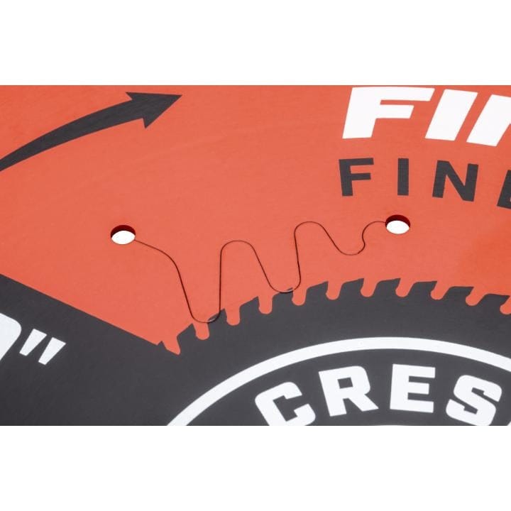 Detailed close-up showing one of the curved laser cut expansion slots on the Crescent 10-Inch saw blade, designed to reduce burning and minimize vibration during cutting.
