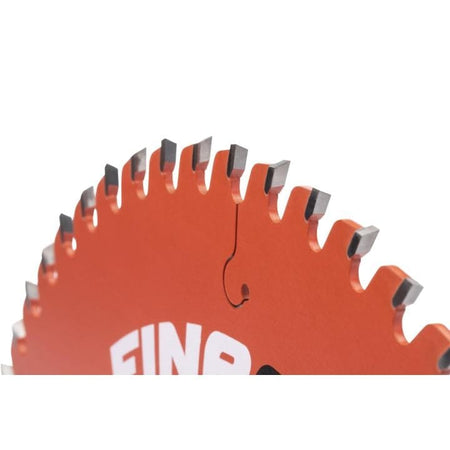 Close-up of the perimeter of the circular saw blade, clearly showing the aggressive angle and sharp tips of the premium carbide teeth for a fine finishing cut.