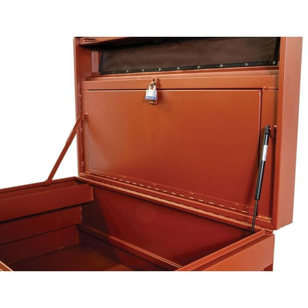 Close-up of Crescent JOBOX chest showing open lid with gas strut and metal arm, and a padlocked internal compartment for secure tool storage.