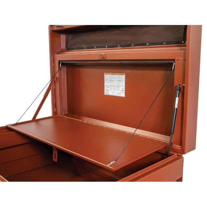 Crescent JOBOX storage chest with open lid supported by gas struts and cables, revealing interior compartment and safety label inside the lid.