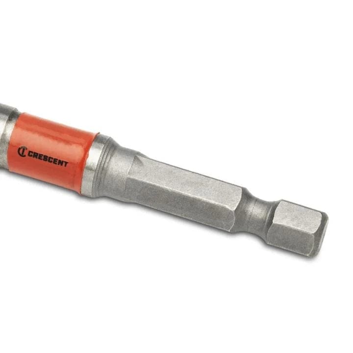 Extreme close-up of the 1/4 inch impact-rated hex shank on the Crescent CDSP-453 spade bit, featuring a secure power groove for quick-change chucks and a red branding collar.