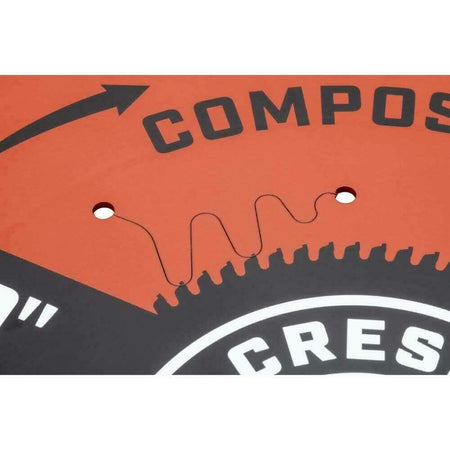 A close-up detail of the laser-cut vibration slot on the orange Crescent composite decking saw blade.