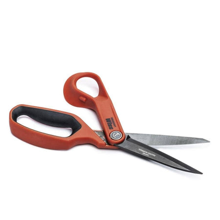The Crescent Wiss CW10TL shears shown in an open position, emphasizing the sharp titanium-coated cutting edge and ergonomic rawhide handles.
