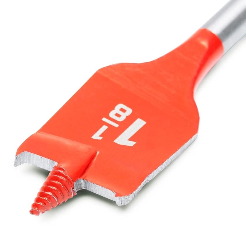 Macro shot of the 7/8 inch spade bit tip detailing the self-feeding screw point and the sharp cutting spurs on the red paddle edges.