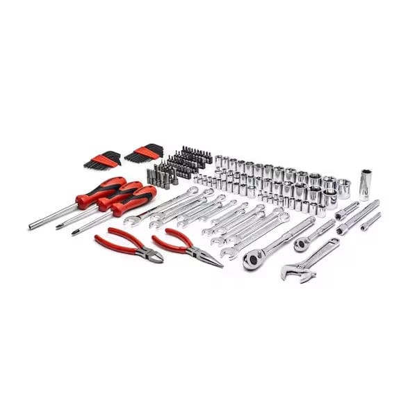 Comprehensive hand tool set laid out on a white surface. Includes screwdrivers, pliers, hex keys, sockets, ratchets, combination wrenches, adjustable wrench, and assorted bits. Organized for professional or DIY use.