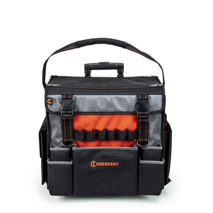 Professional-grade tool bag with reinforced sides, hard bottom, and orange-stitched handle. Includes multiple compartments and flap pocket with “TECH OT-MC” and “VETO PRO PAC” branding. Built for durability and tradesperson use.