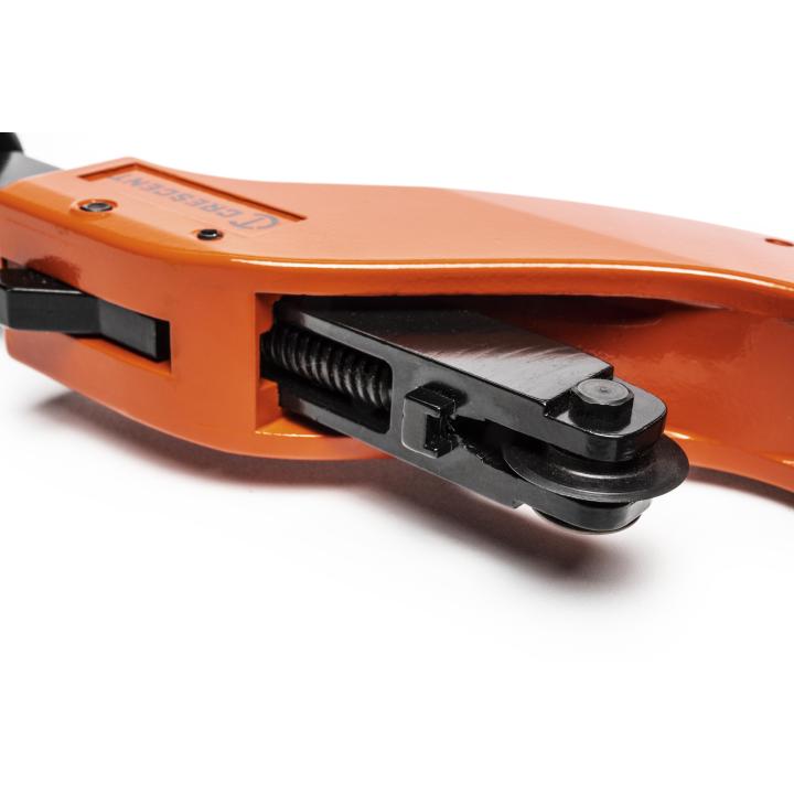 Image shows a curved, orange tool with a smooth surface.  You can feel a black, rectangular part with a small wheel at its end.  Inside the rectangular part, there's a spring that pushes the wheel outwards.  This tool is used to cut metal pipes by applying pressure with the wheel as it rotates.