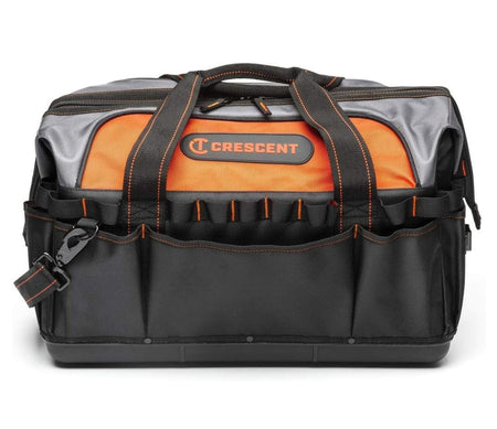 A straightforward, eye-level studio shot of the closed Crescent 20-inch contractor tool bag, highlighting the hard polypropylene base, the black and orange color scheme, and the front exterior pockets.