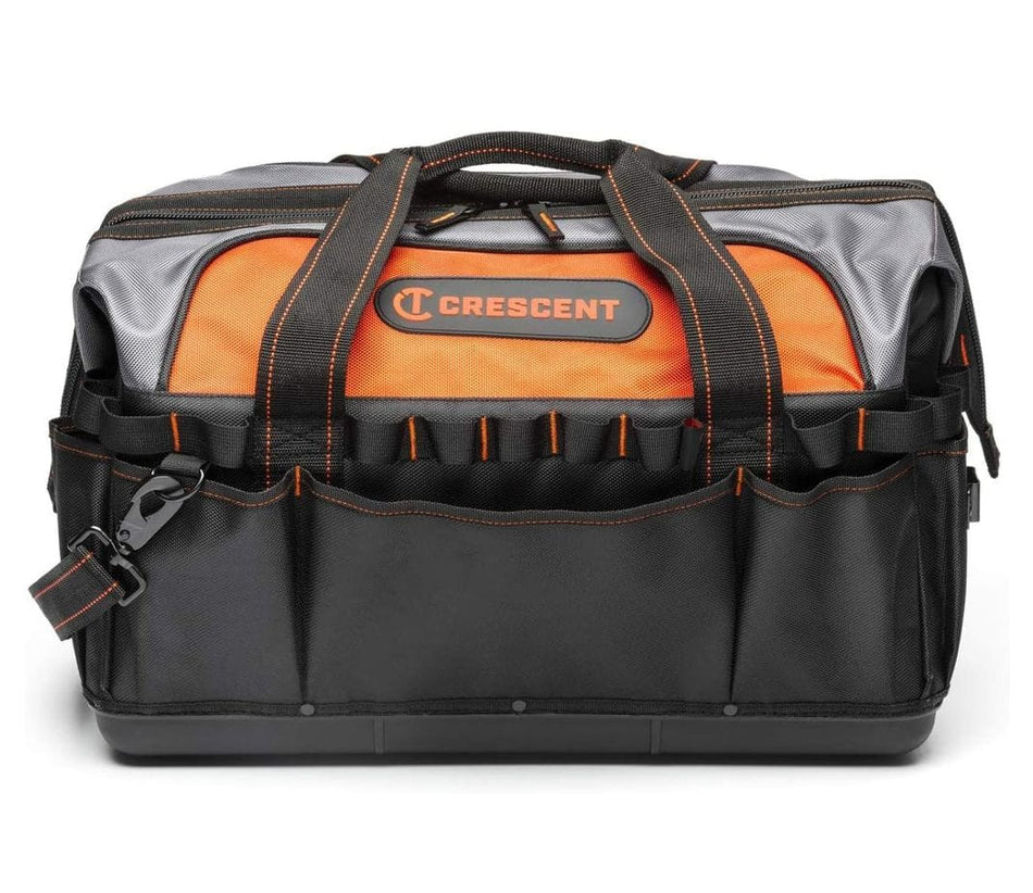 A straightforward, eye-level studio shot of the closed Crescent 20-inch contractor tool bag, highlighting the hard polypropylene base, the black and orange color scheme, and the front exterior pockets.