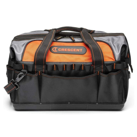 A straightforward, eye-level studio shot of the closed Crescent 20-inch contractor tool bag, highlighting the hard polypropylene base, the black and orange color scheme, and the front exterior pockets.